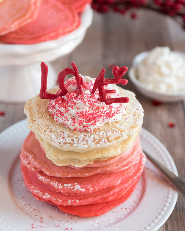 pink ombre pancakes on a white plate
