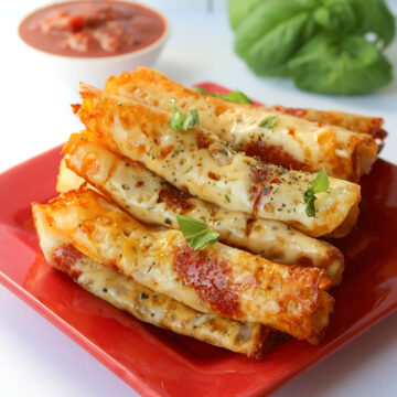 keto pepperoni pizza rolls on a red plate