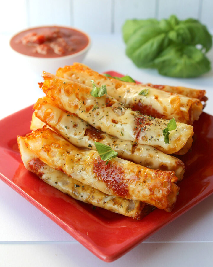 keto pepperoni pizza rolls on a red plate