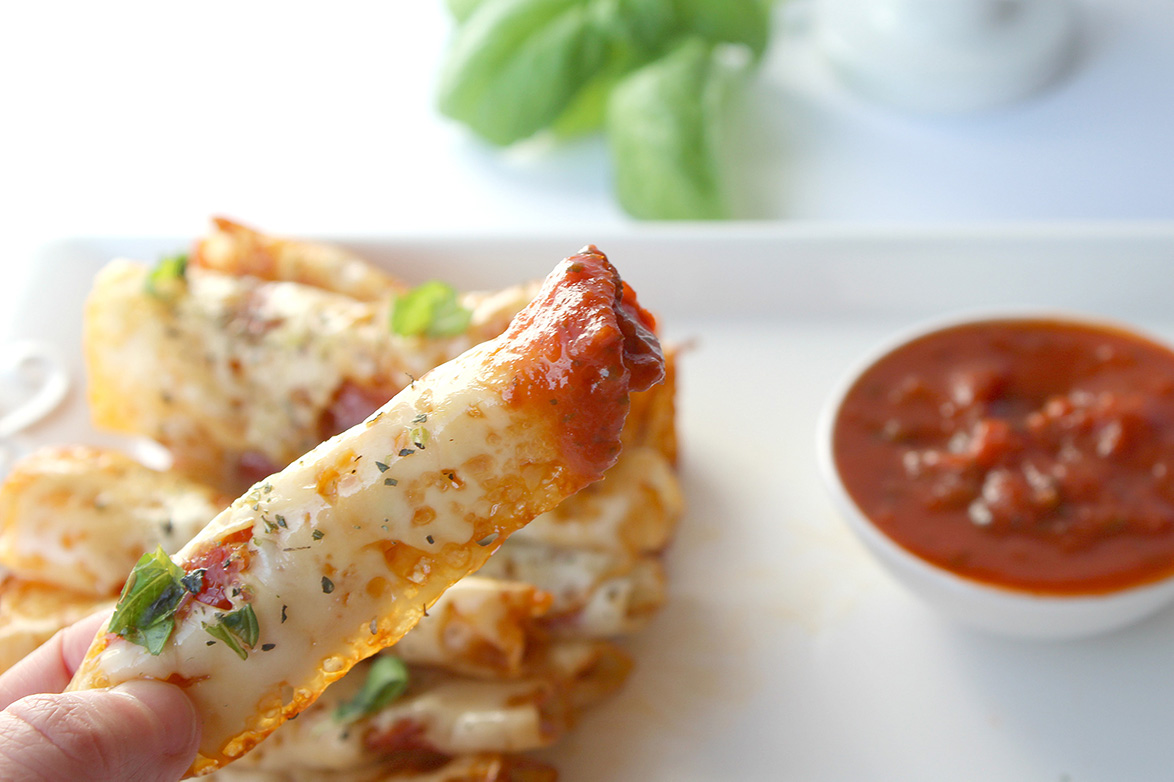 pizza roll dipped in red sauce 