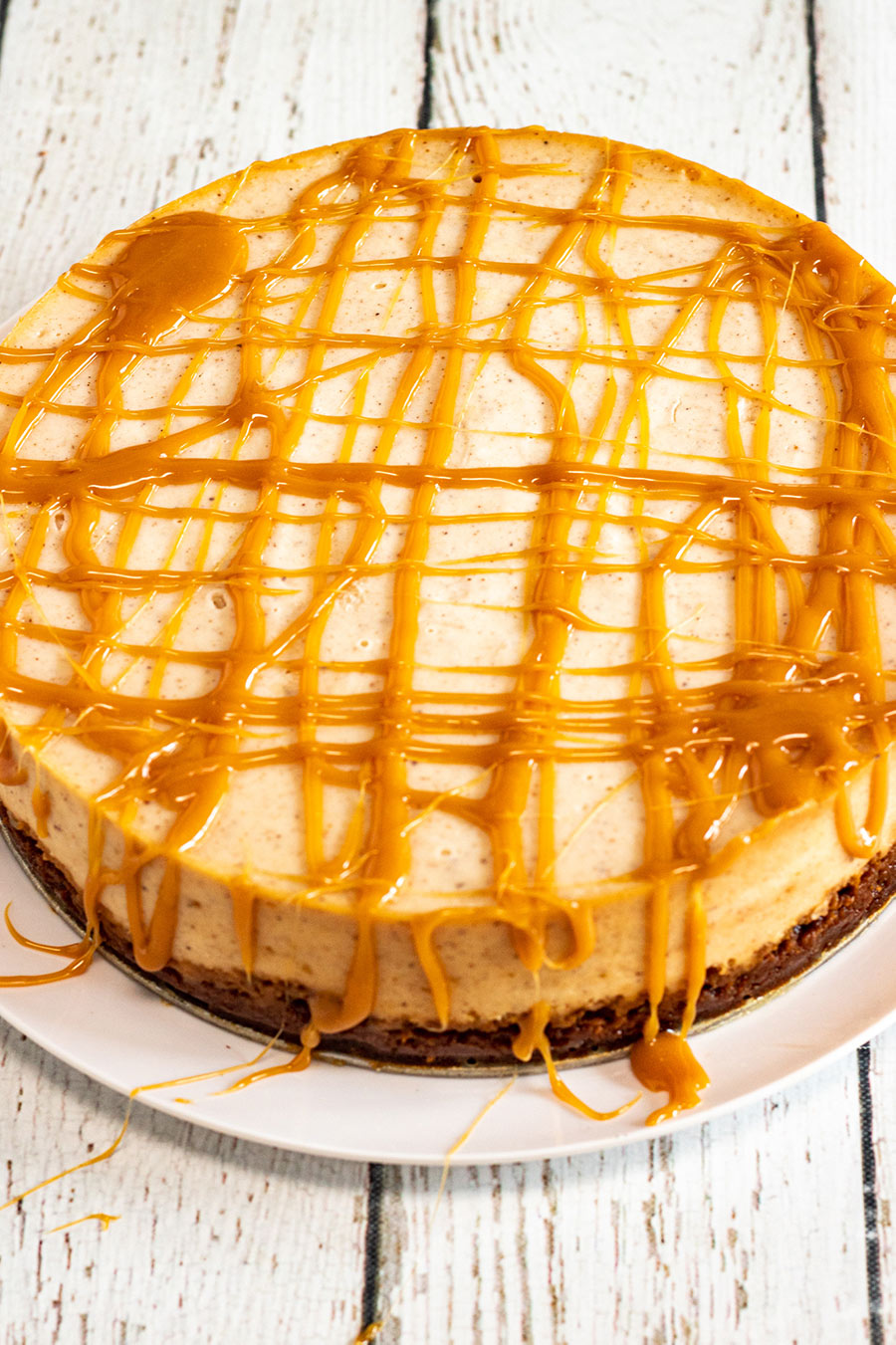 instant pot eggnog cheesecake with drizzled caramel on top. 