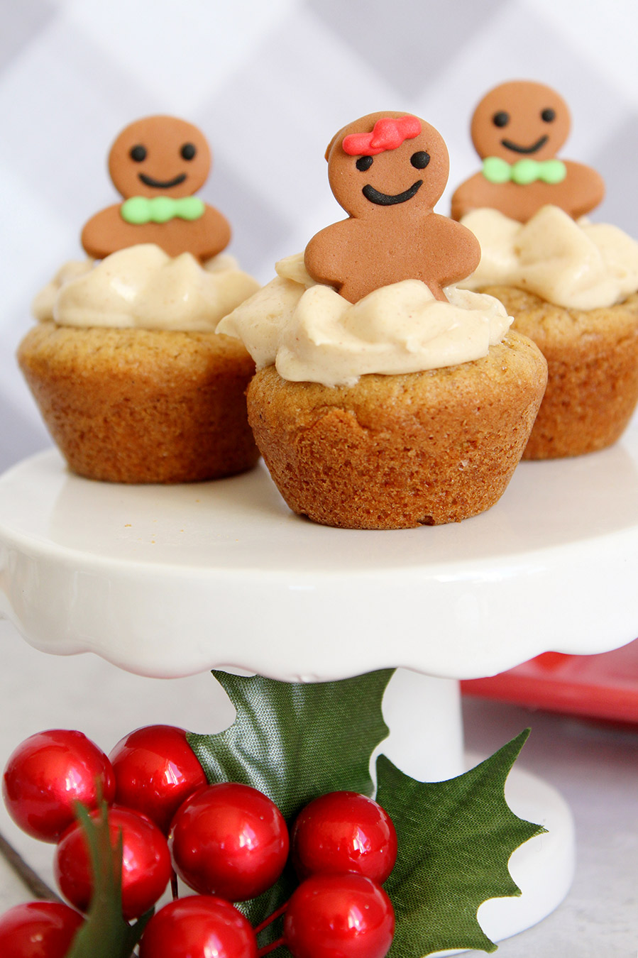 three gingerbread cheesecake cookie cups on a white cake stand. 