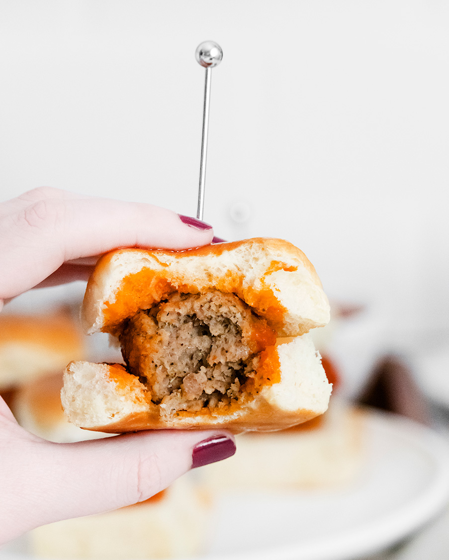 a bitten meatball slider up close. 