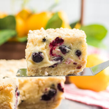 a slice of lemon blueberry cream cake up close.