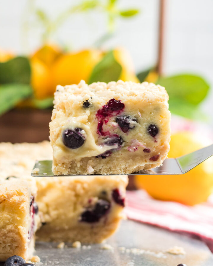 a slice of lemon blueberry cream cake up close.