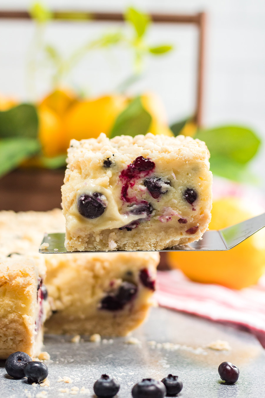 a slice of lemon blueberry cream cake up close. 