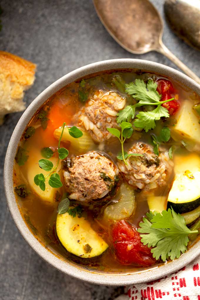 albondiga soup with herbs and squash.