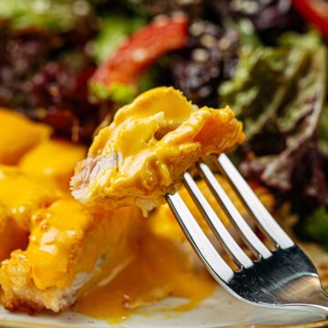 gluten free chicken curry on a plate with a fork.