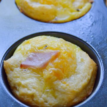 ham and cheese egg cup in a muffin tin up close.