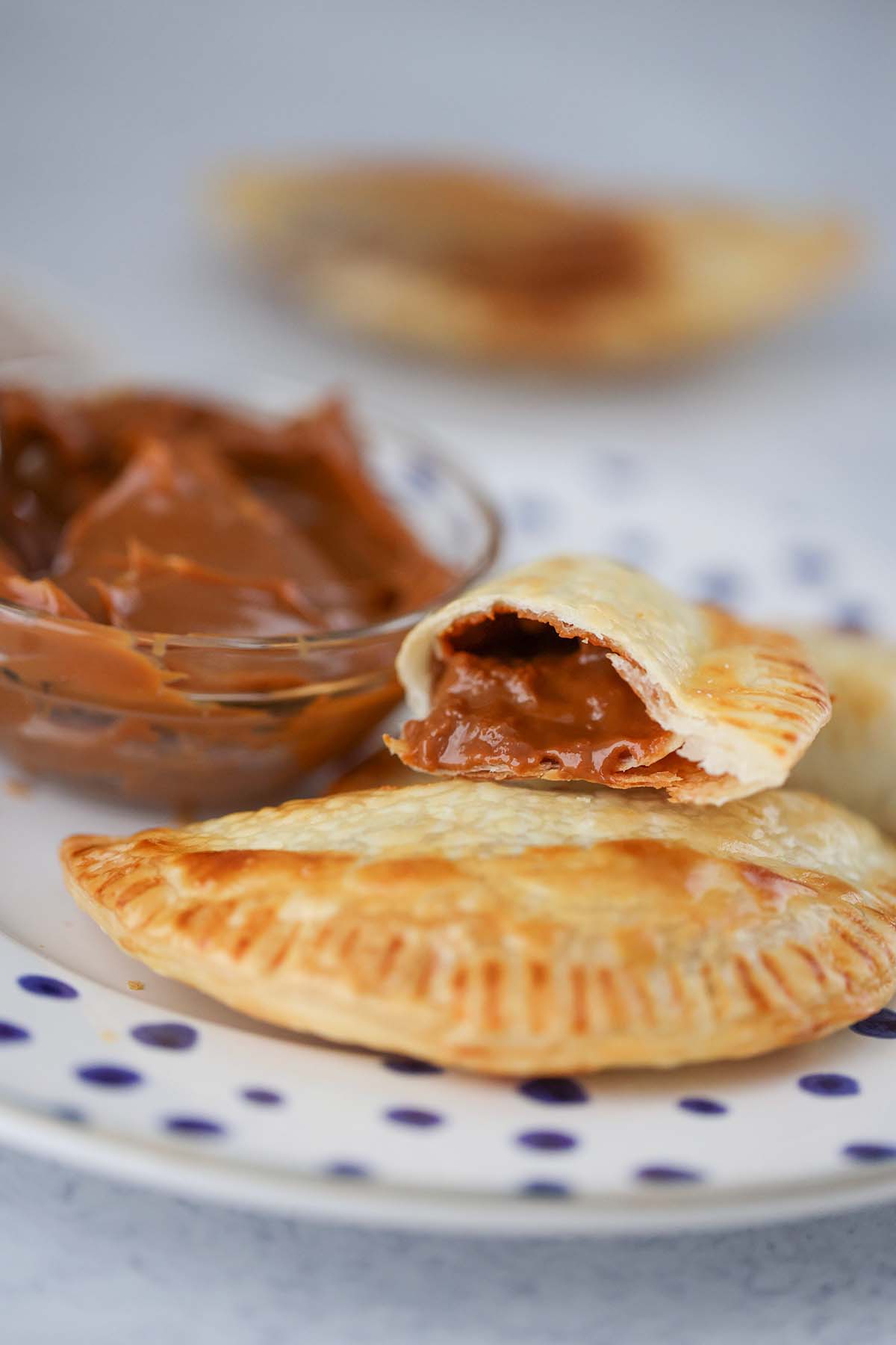 dulce de leche empanada sliced in half. 