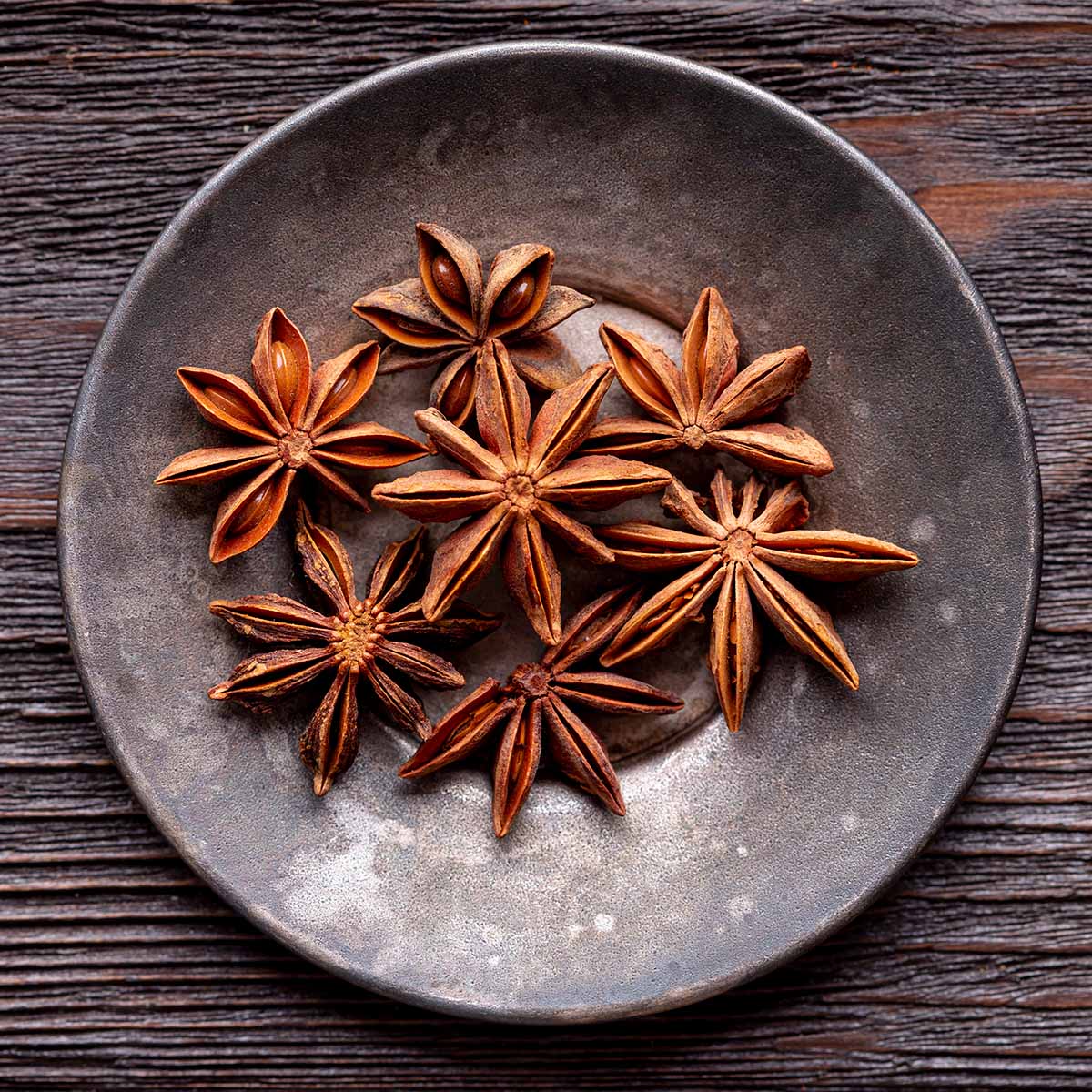 seven star anise on a plate.