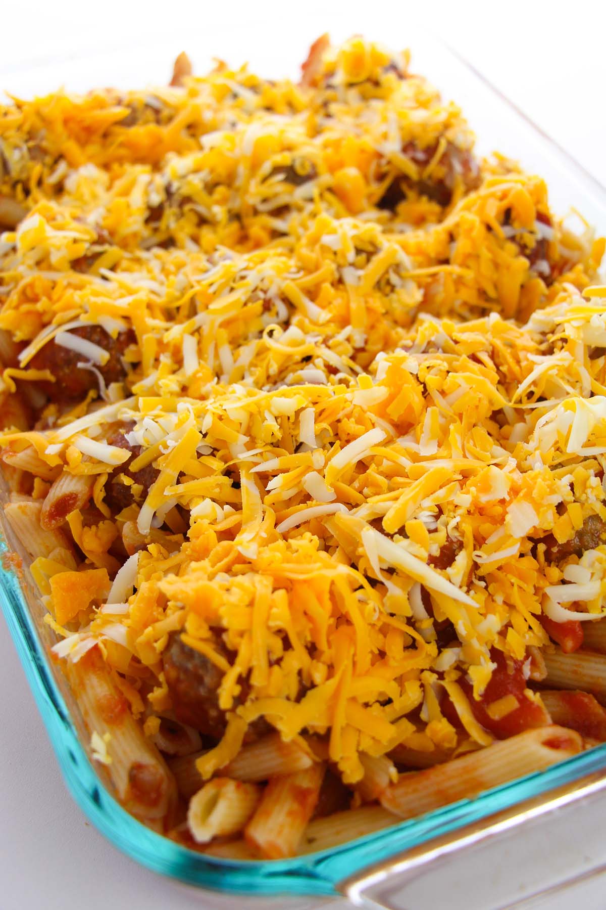 meatball casserole with shredded four cheese blend on top.
