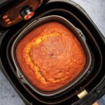 square cornbread in the air fryer basket.