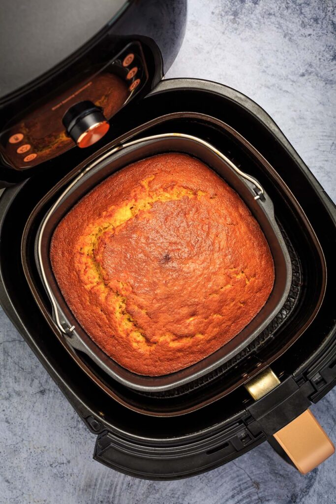 square cornbread in the air fryer basket.