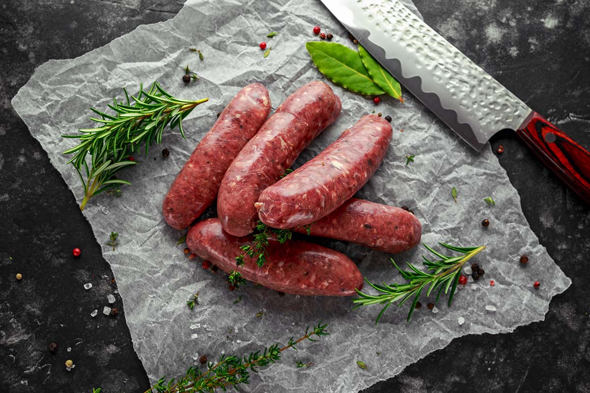 five raw Italian sausages.