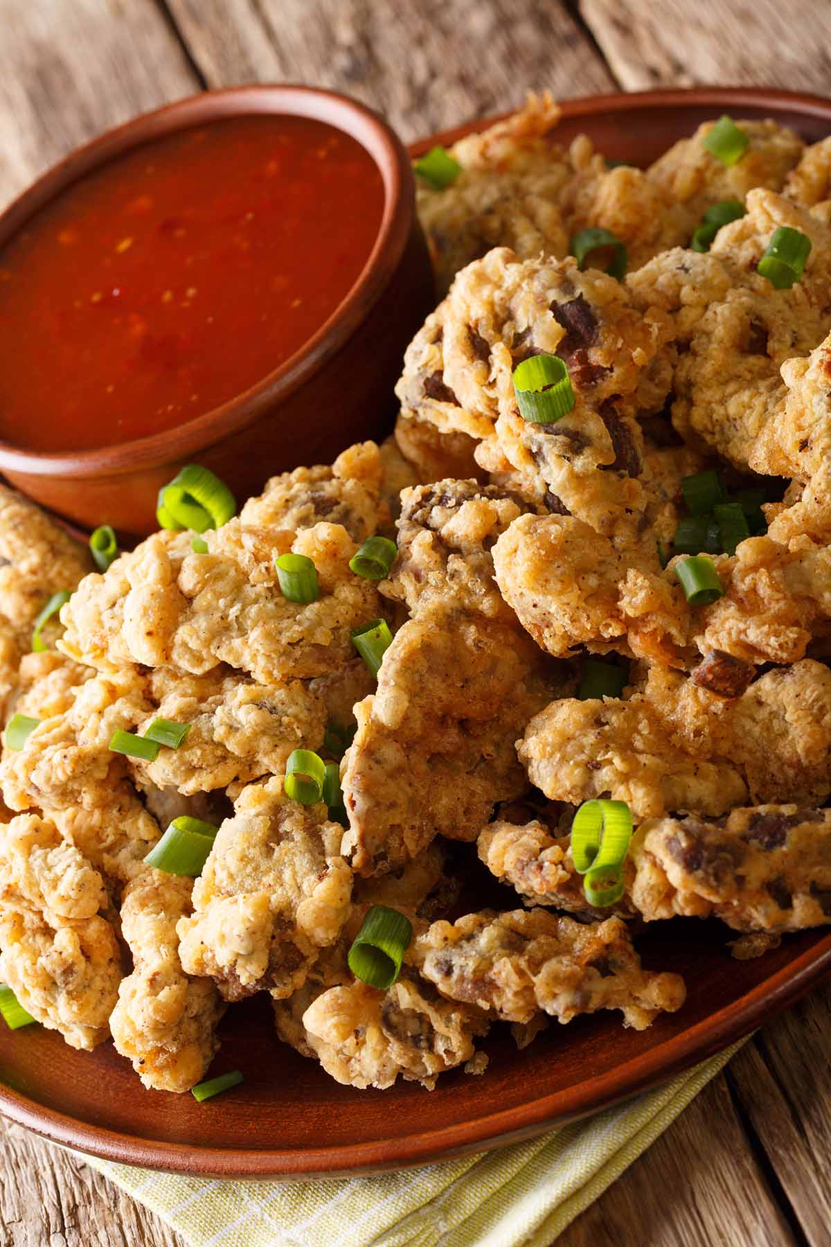 air fryer chicken gizzards with marinara sauce on the side.