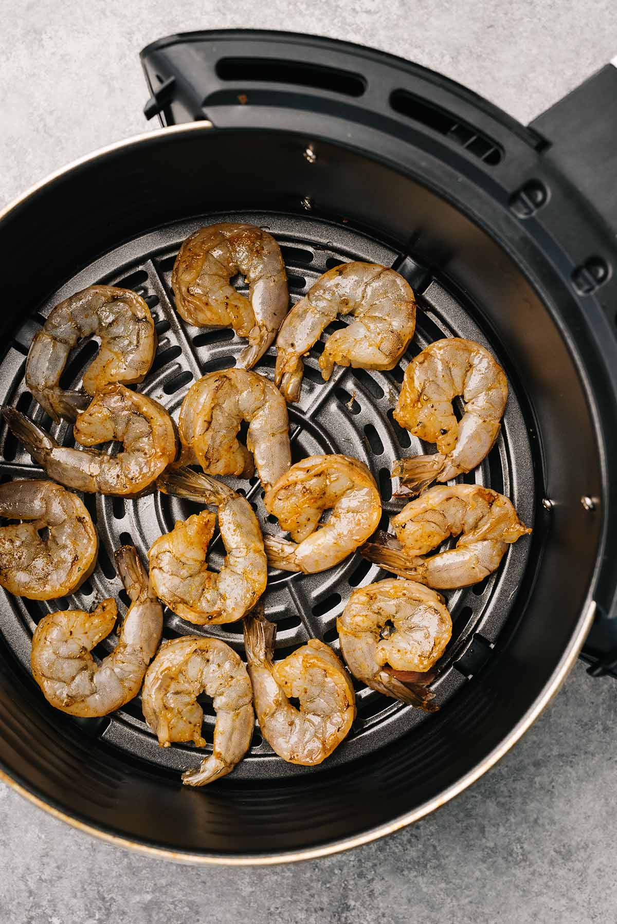 old bay shrimp in air fryer basket.