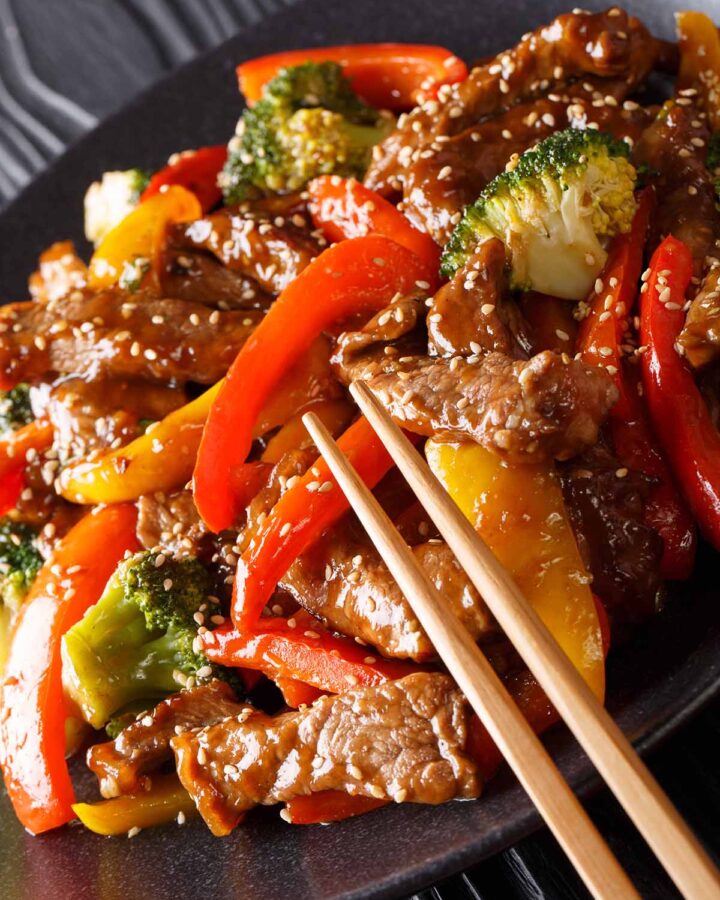 black pepper angus steak on a plate with chopsticks.