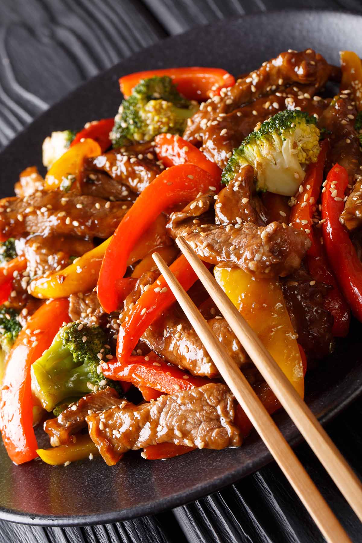 black pepper angus steak on a plate with chopsticks. 