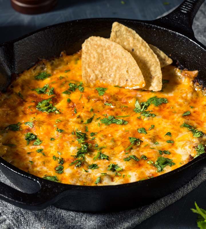 oaxaca queso dip in a cast iron skillet.