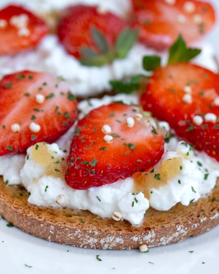 whipped cottage cheese on toast with strawberries on toast.