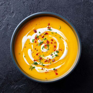 creamy butternut squash soup in a bowl.