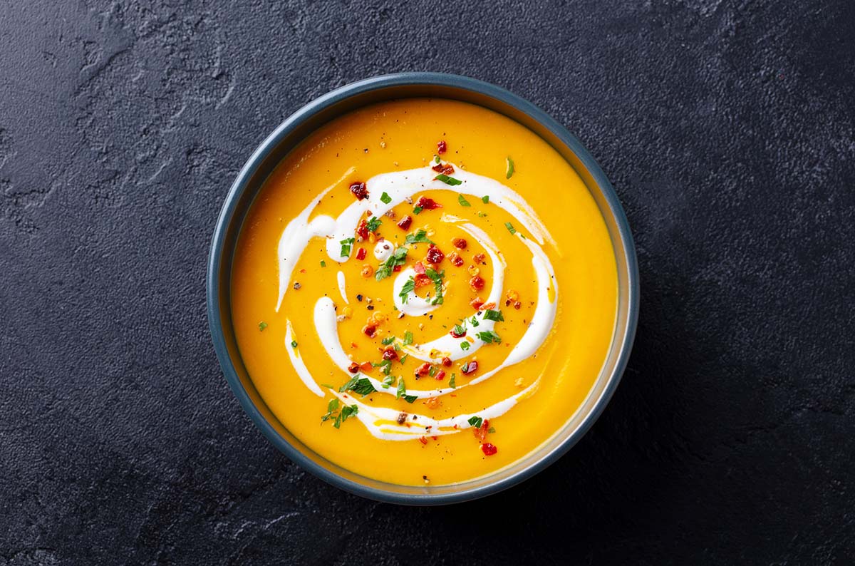 creamy butternut squash soup in a bowl.
