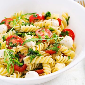 high protein pasta salad in a white bowl.