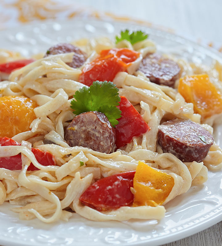 kielbasa pasta on a white plate.