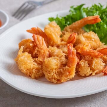 fried rock shrimp on a white plate.
