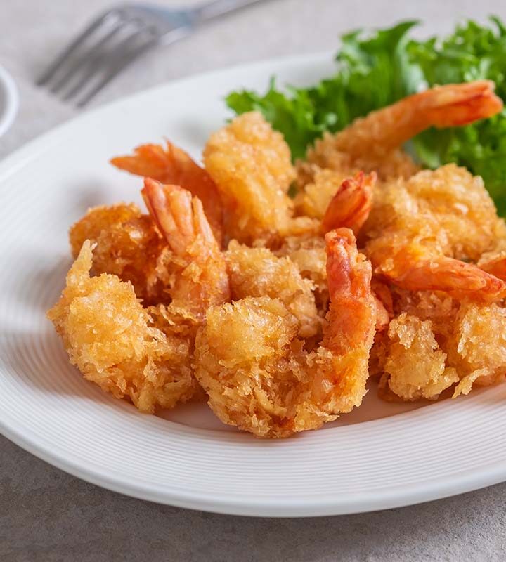 fried rock shrimp on a white plate.