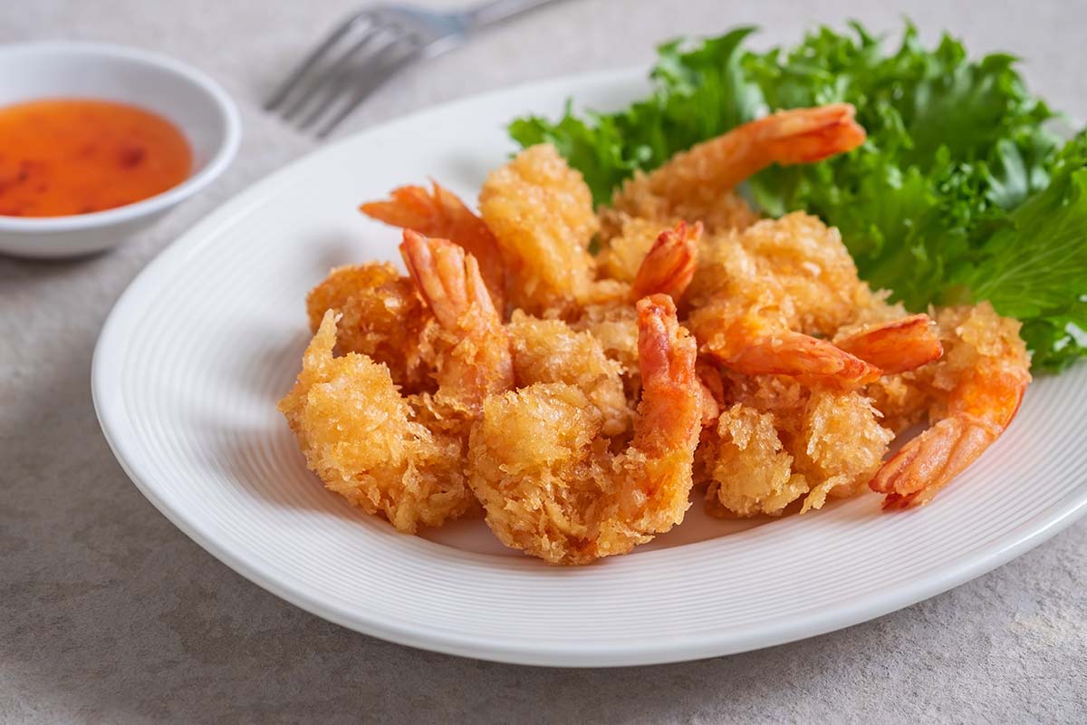 fried rock shrimp on a white plate.