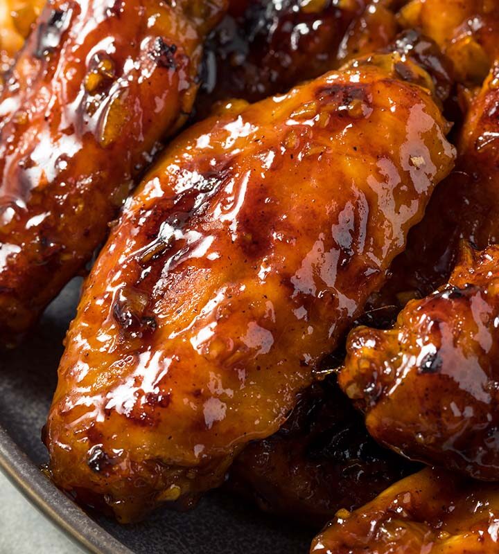 hot honey chicken wings in a bowl.