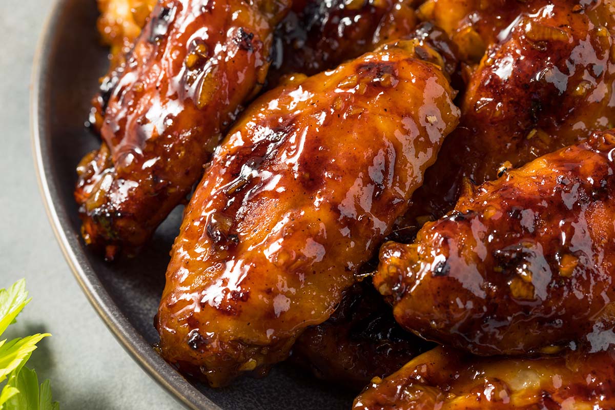 hot honey chicken wings in a bowl.