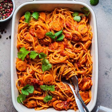 Linguica spaghetti in a white baking dish.