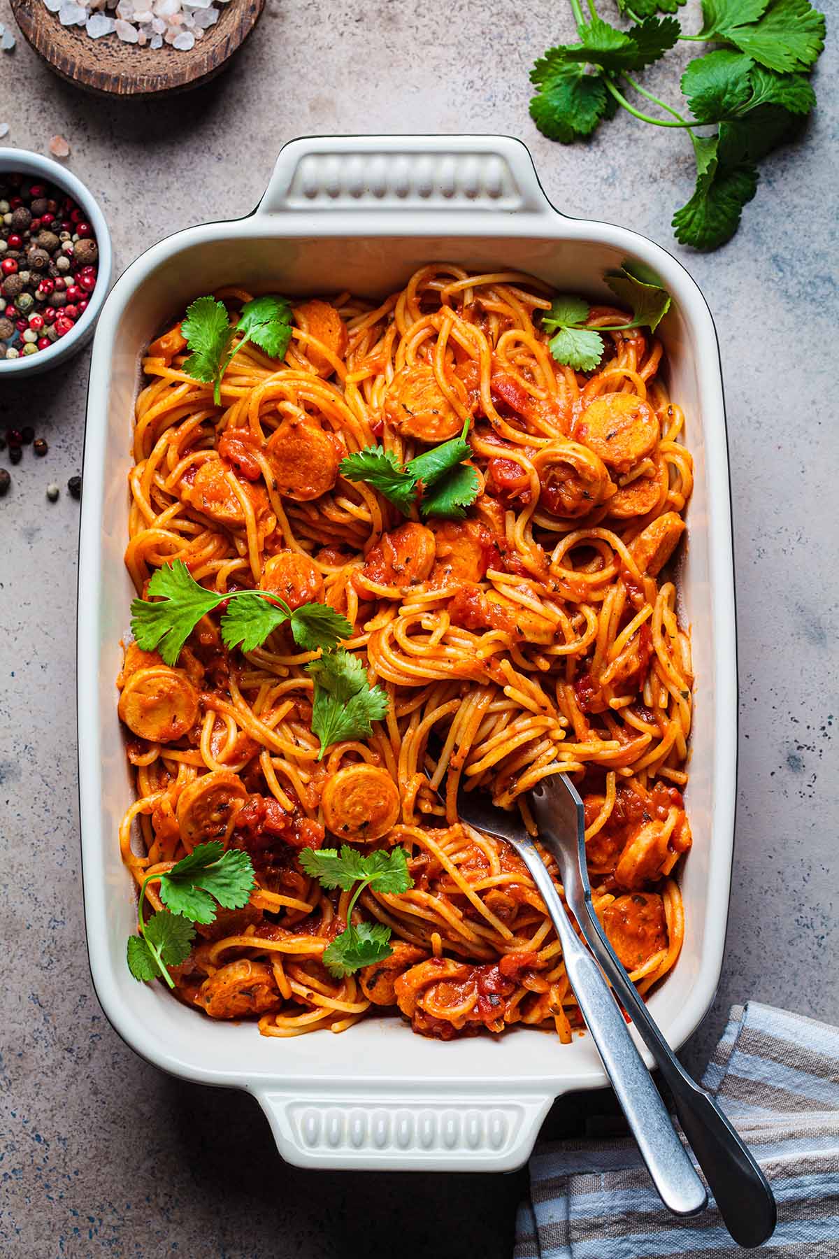 Linguica spaghetti in a white baking dish. 