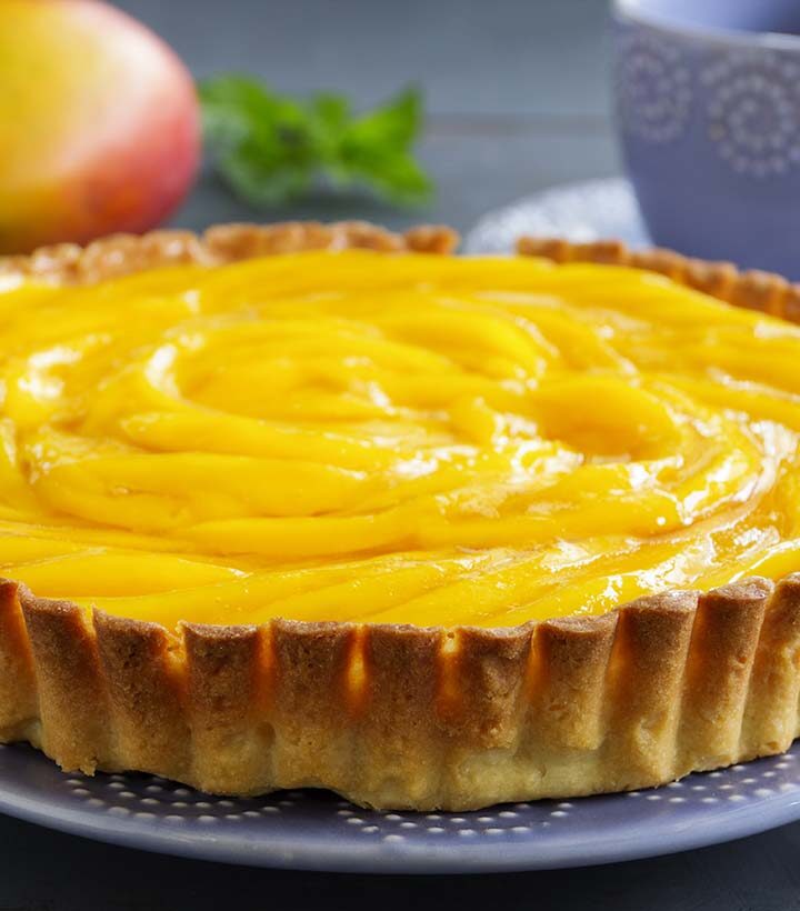 mango peach pie on a plate.