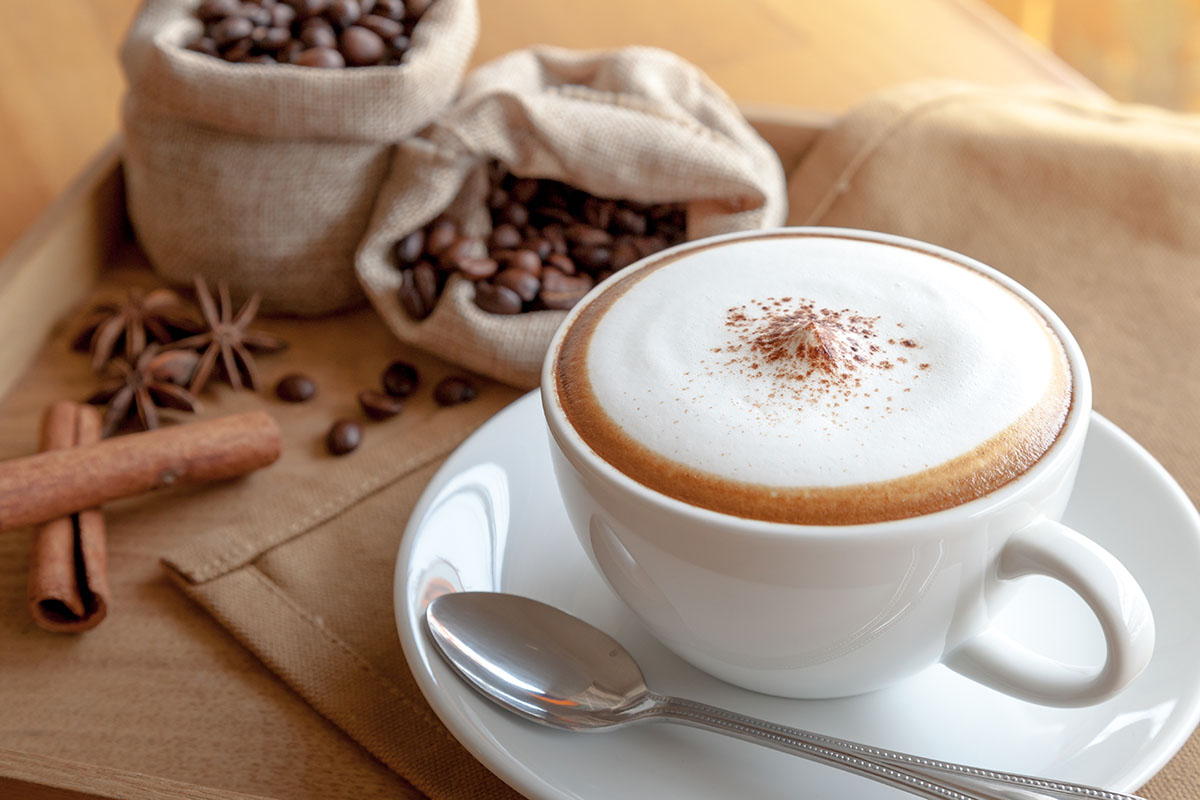 a nespresso cappuccino in a white cup. 