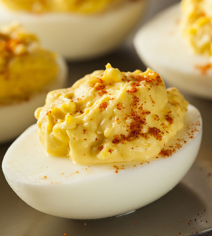 quail deviled eggs on a platter.