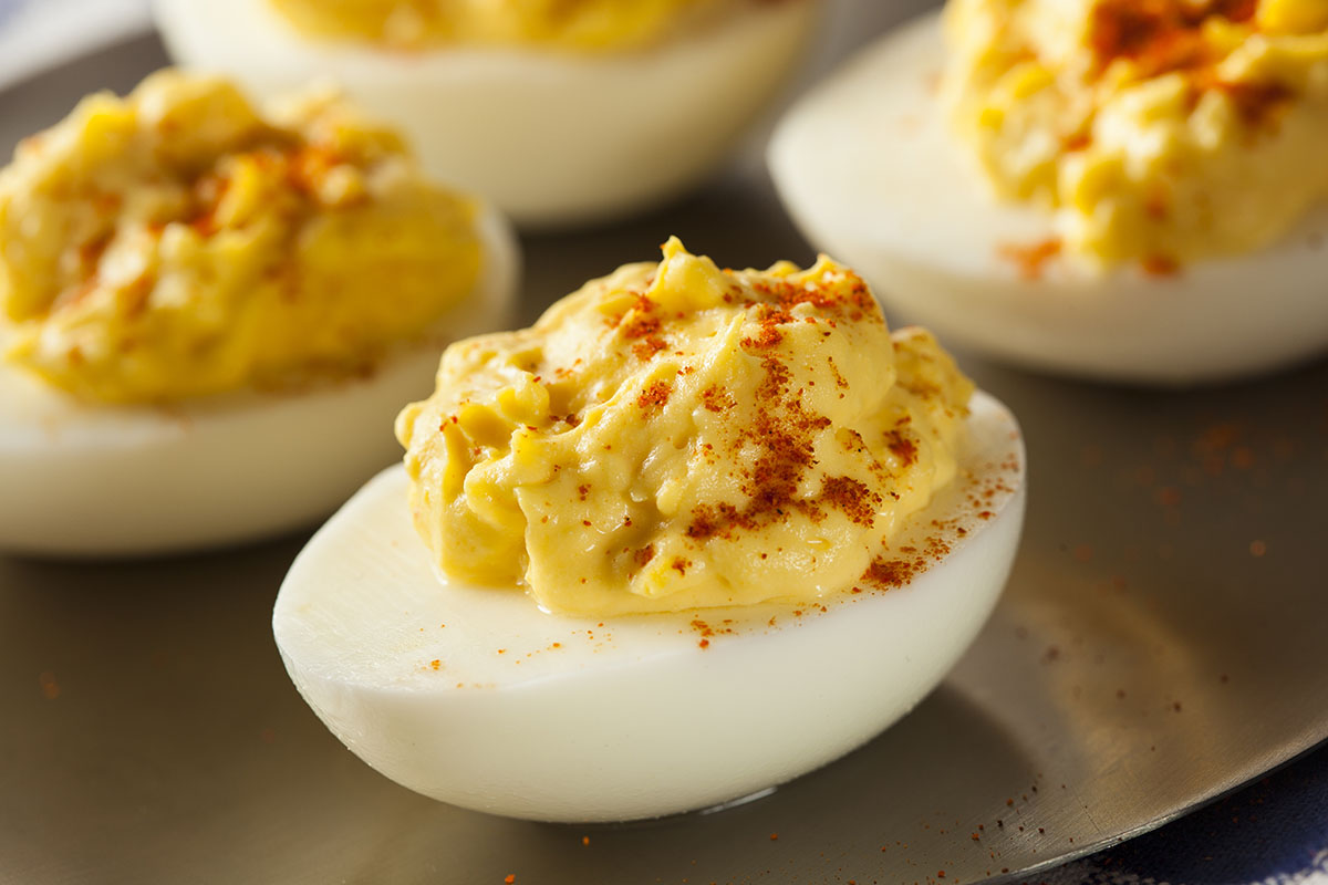 quail deviled eggs on a platter.