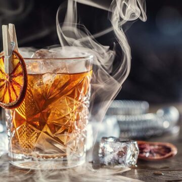smoked whiskey cocktail on the rocks.
