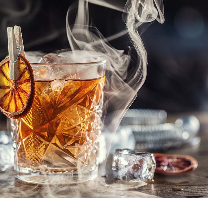 smoked whiskey cocktail on the rocks.