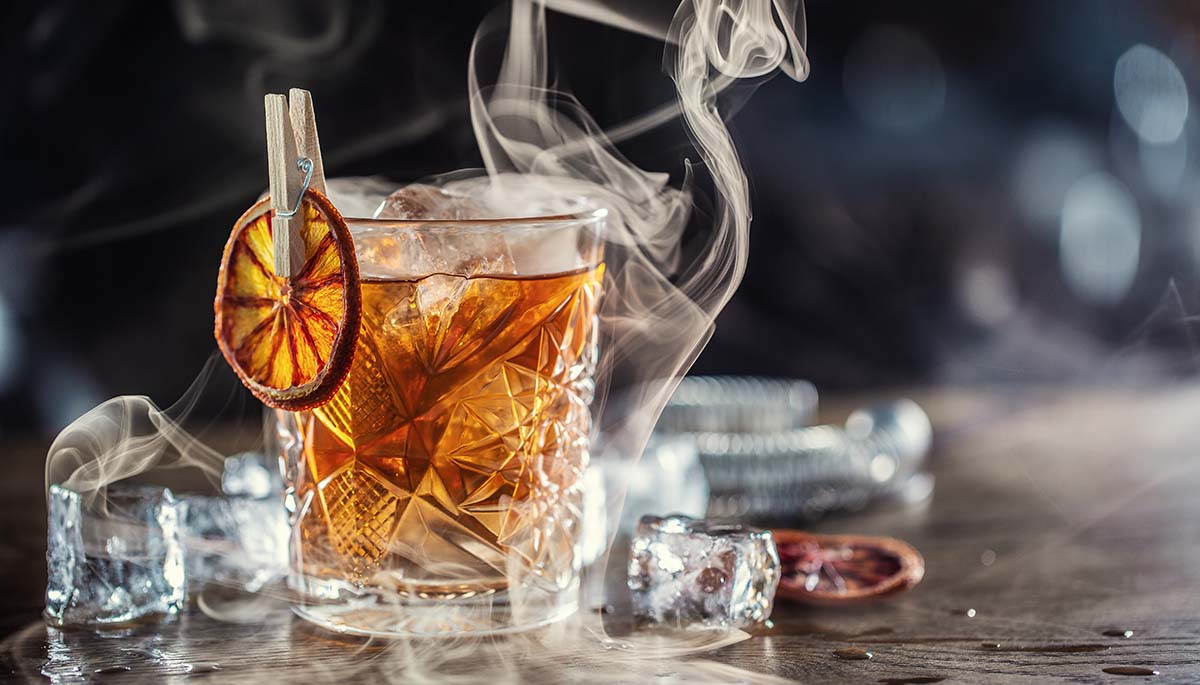 smoked whiskey cocktail on the rocks.