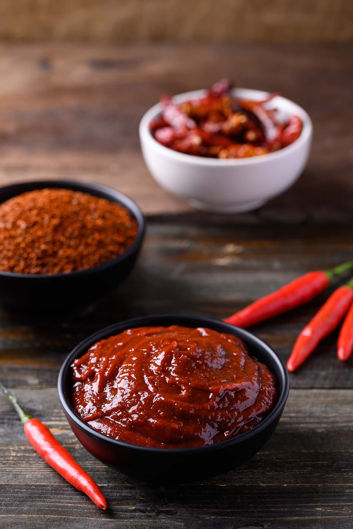 gochujang paste in a black bowl.