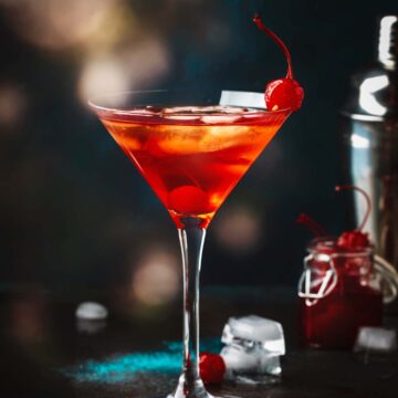 bourbon martini with cherries on the side.
