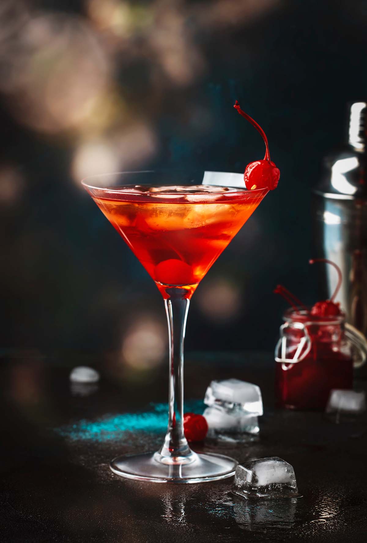 bourbon martini with cherries on the side.