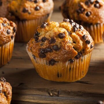 gluten free chocolate chip muffins on a wooden board.