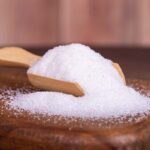 a scoop of granulated sugar.