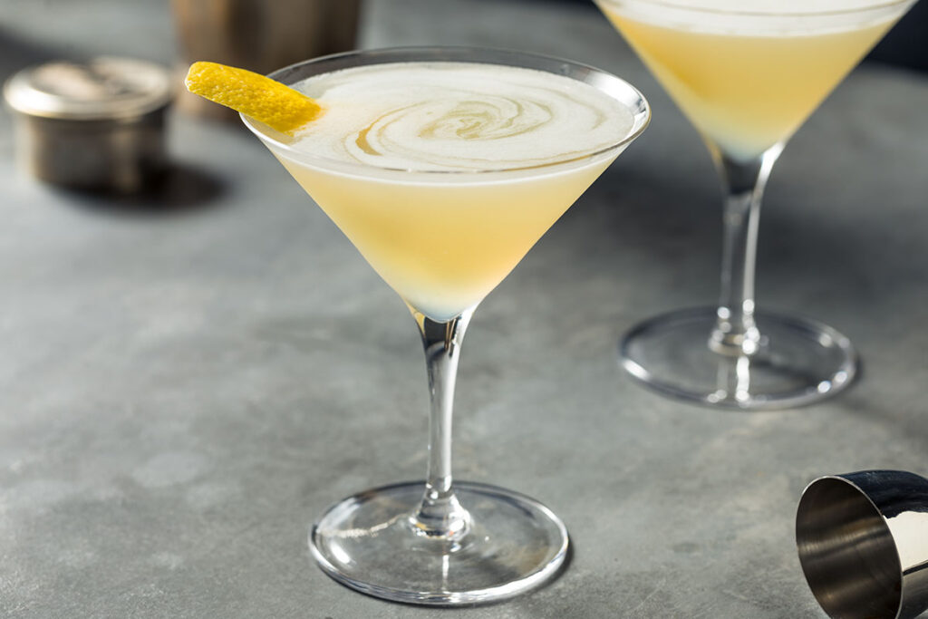 yellow cocktail in a martini glass.