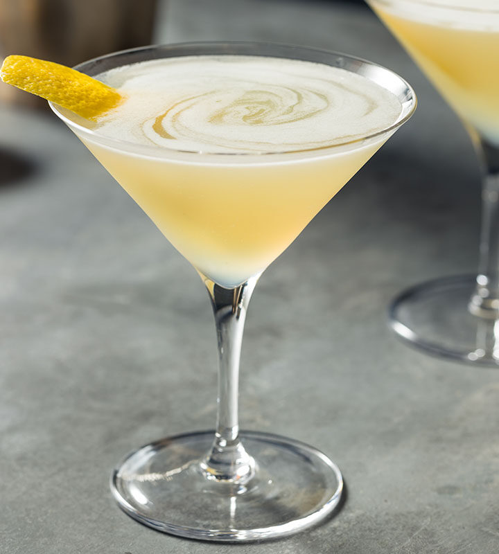 yellow cocktail in a martini glass.